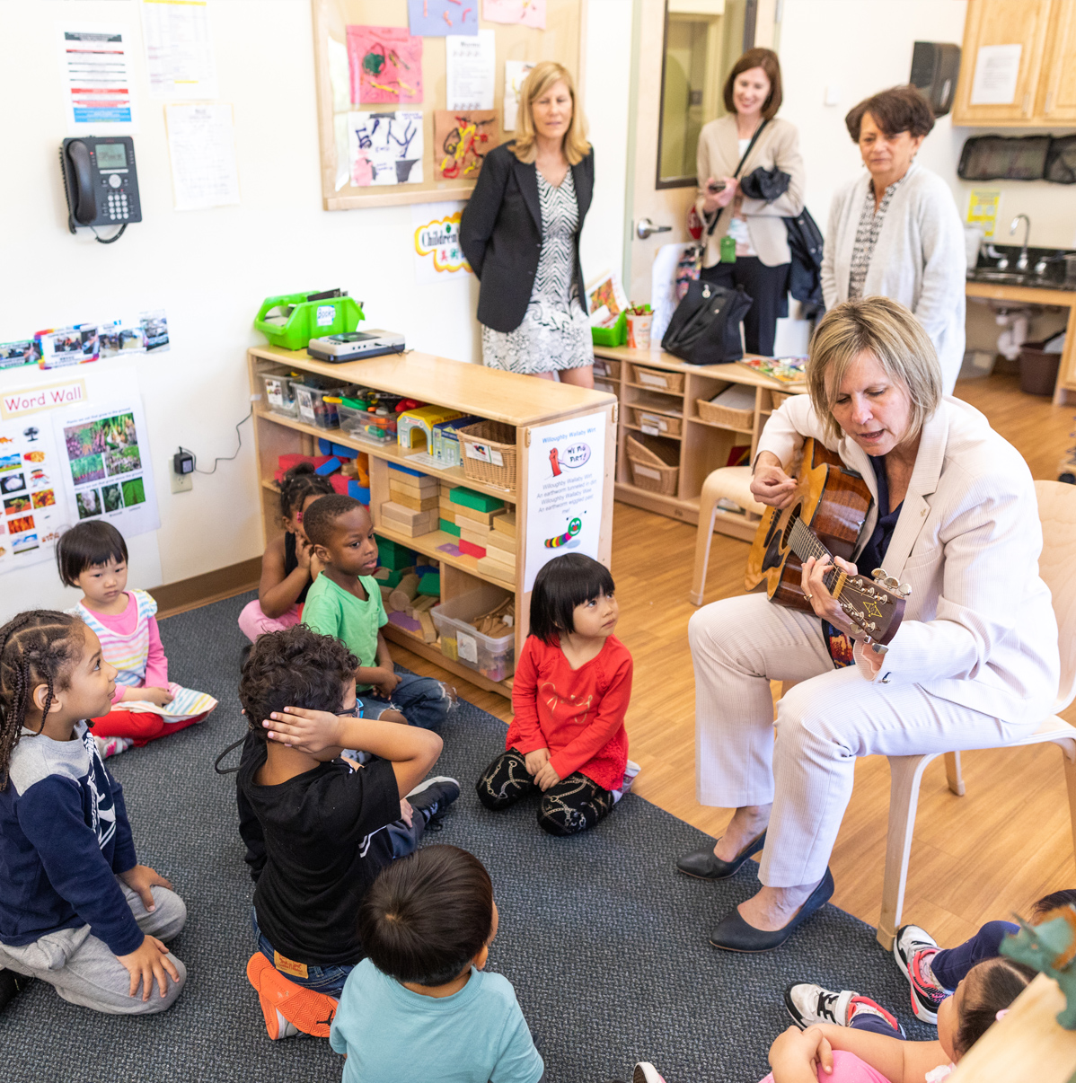 Early head start students listening to live music