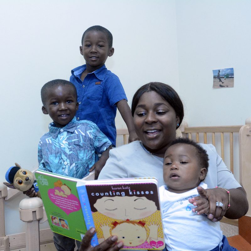 Adrienne Brown reading to her children