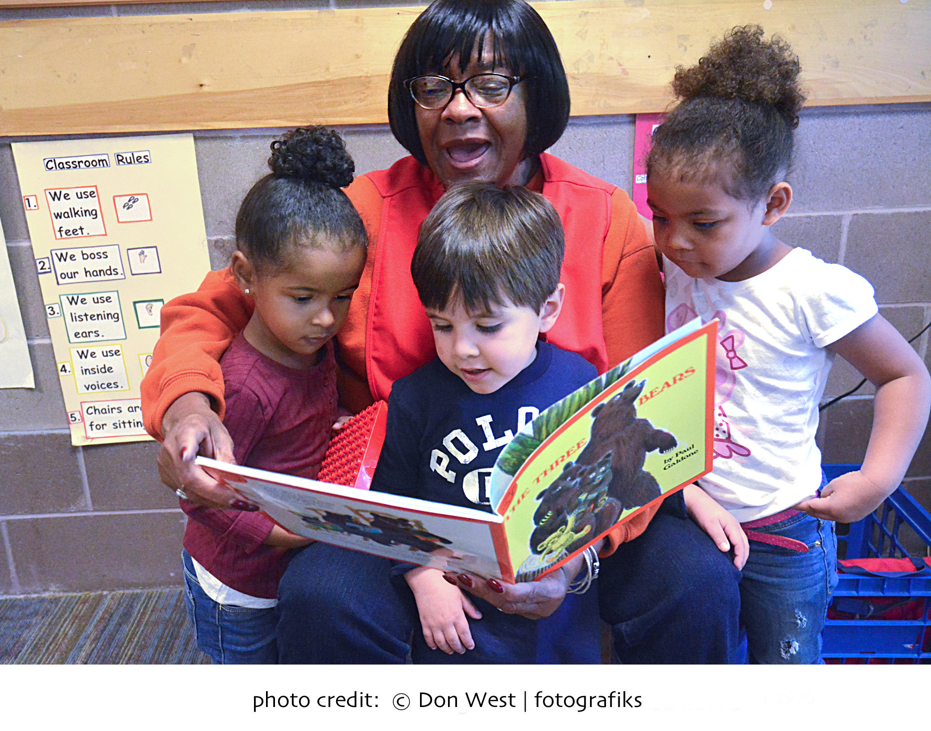 Foster Grandparent reading to children of head start program
